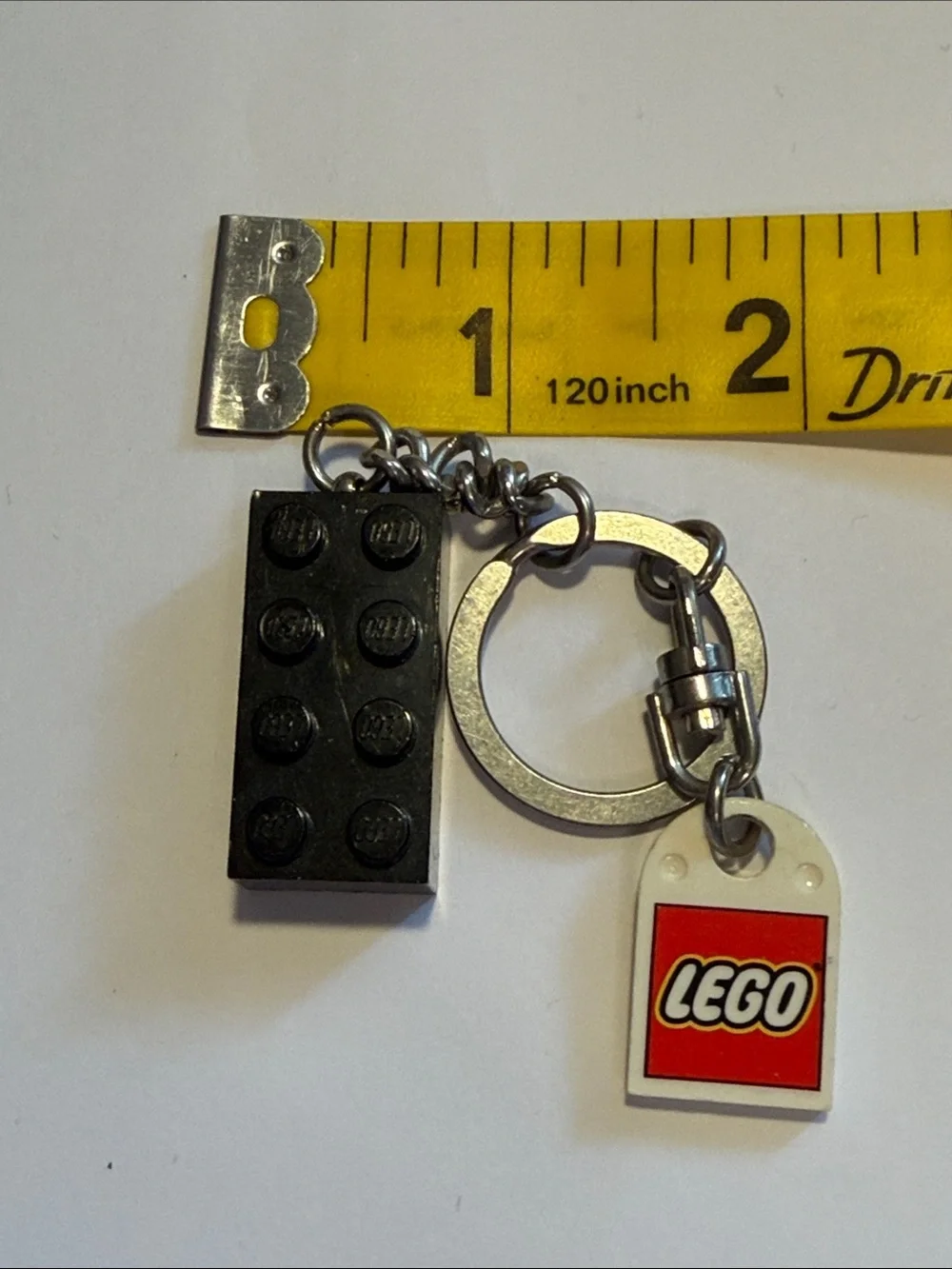 Lego Black Brick Keychain with White and Red Logo Tag